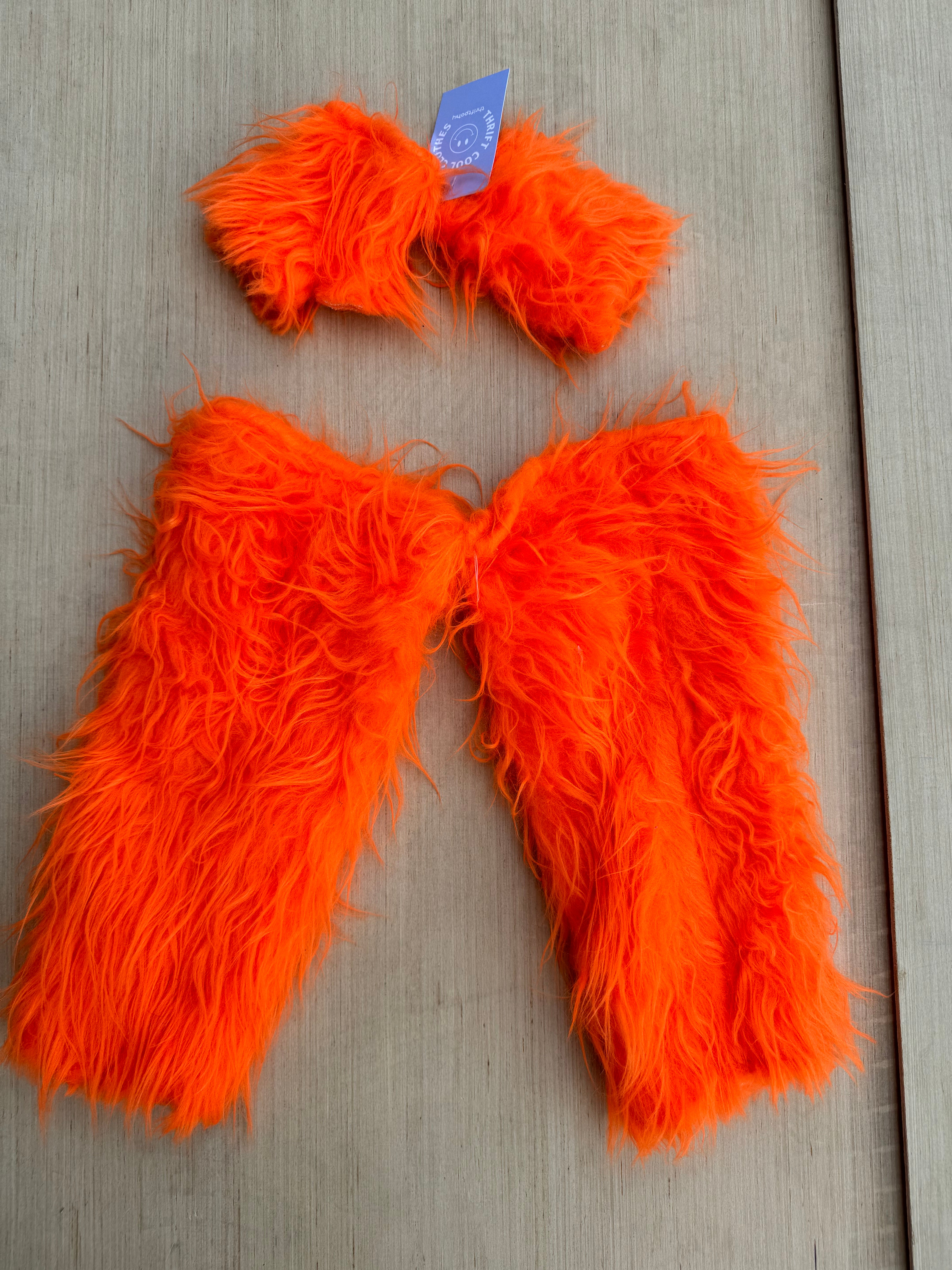 orange  fuzzy leg warmers and fingerless gloves